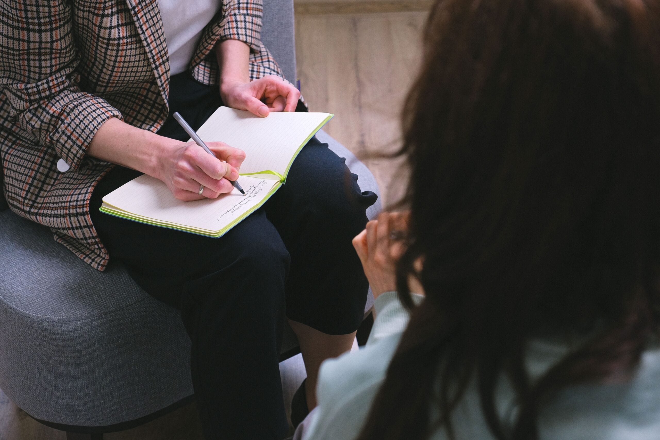Psychologist taking notes during a clinical assessment